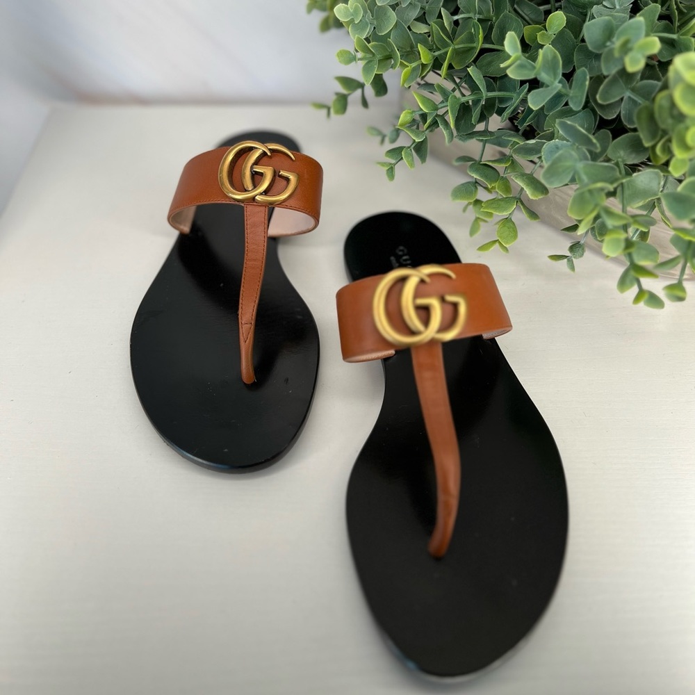 flat sandals from Gucci in cognac